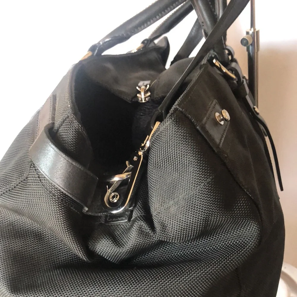 TUMI large black weekender bag. Leather and nylon. Detachable strap.